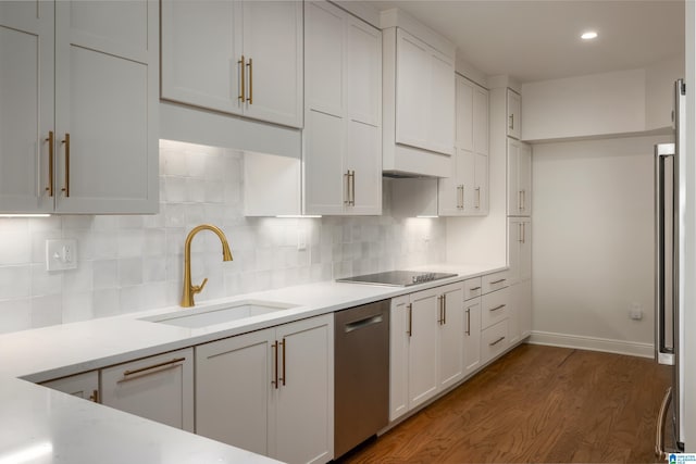 kitchen with dark hardwood / wood-style floors, sink, white cabinets, stainless steel dishwasher, and black electric cooktop