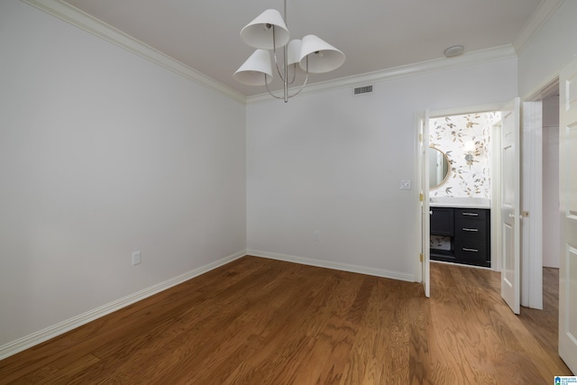 unfurnished bedroom with crown molding and hardwood / wood-style flooring