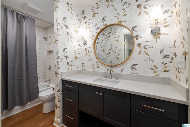 full bathroom with vanity, wood-type flooring, shower / tub combo with curtain, and toilet