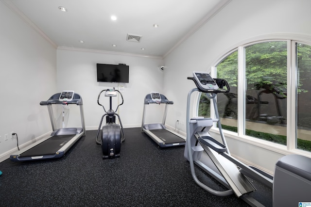 exercise room with ornamental molding