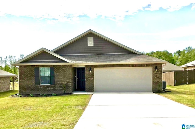 view of front facade featuring a front yard and a garage