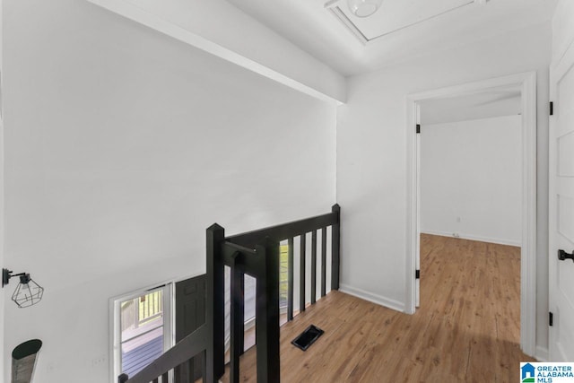 corridor featuring light hardwood / wood-style floors