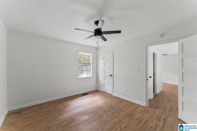 unfurnished bedroom featuring ceiling fan and hardwood / wood-style floors