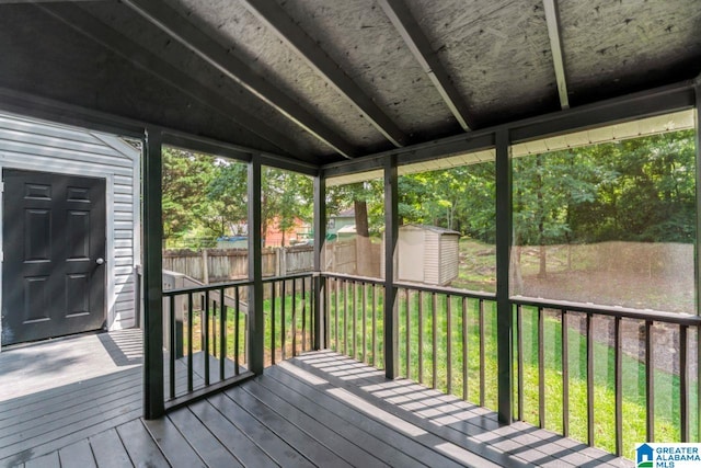 unfurnished sunroom with vaulted ceiling