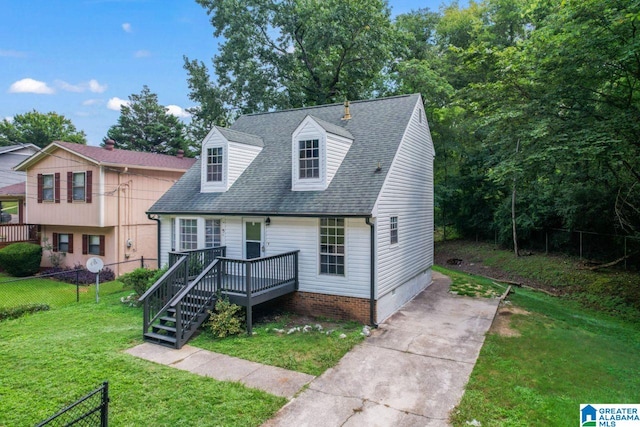 view of front of home with a front lawn and a deck