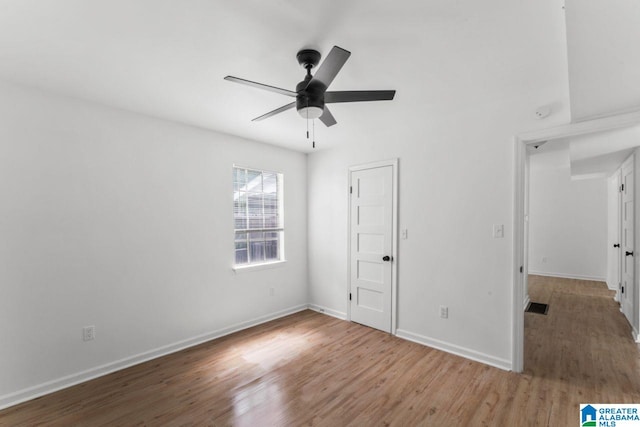 unfurnished bedroom featuring hardwood / wood-style floors and ceiling fan