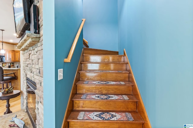 stairway with hardwood / wood-style flooring