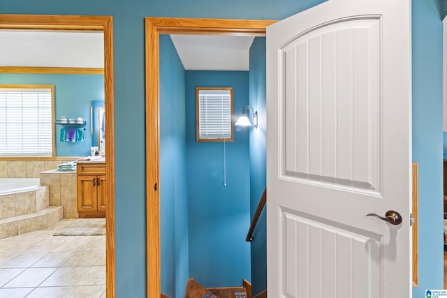 hallway featuring light tile patterned floors