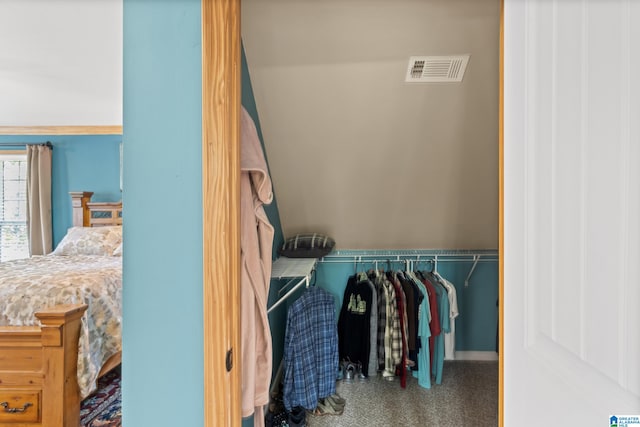 walk in closet featuring carpet