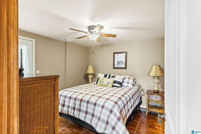 bedroom featuring dark wood-type flooring and ceiling fan