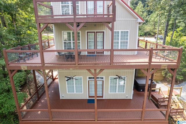 view of home's exterior with a wooden deck and ceiling fan