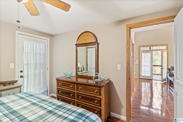 tiled bedroom with ceiling fan