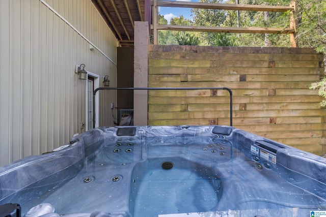 exterior details featuring a hot tub