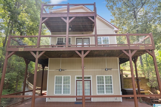 back of house featuring ceiling fan and a deck