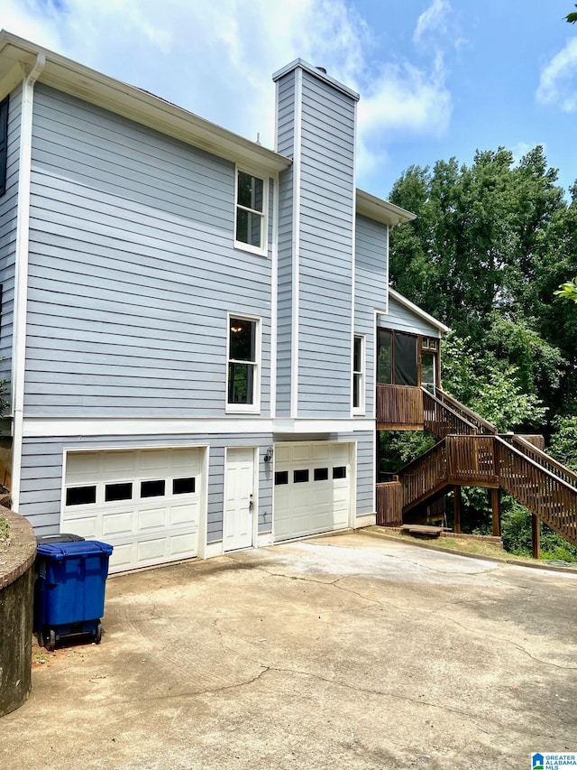 view of side of home with a garage