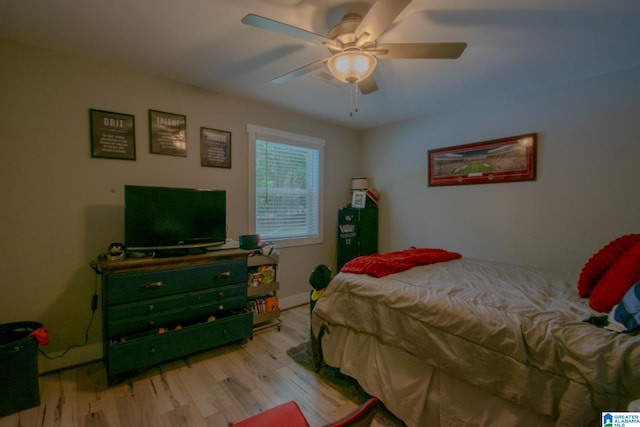 bedroom with ceiling fan and light hardwood / wood-style flooring