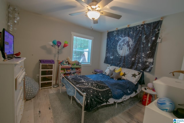 bedroom featuring ceiling fan and light hardwood / wood-style floors