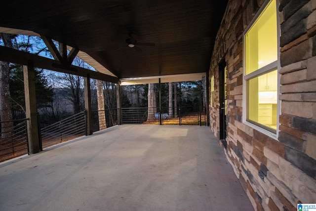 patio terrace at dusk with ceiling fan