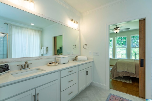 bathroom featuring double sink vanity, crown molding, and ceiling fan