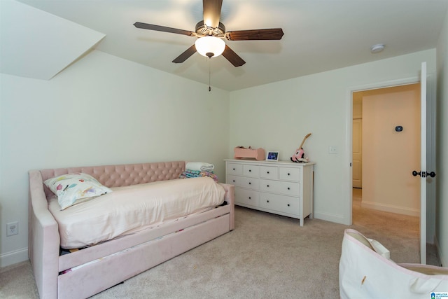 bedroom featuring ceiling fan and light carpet