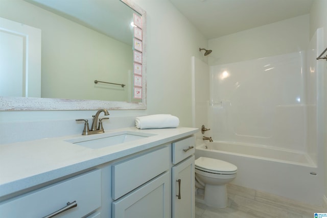 full bathroom featuring tile patterned floors, vanity, tub / shower combination, and toilet