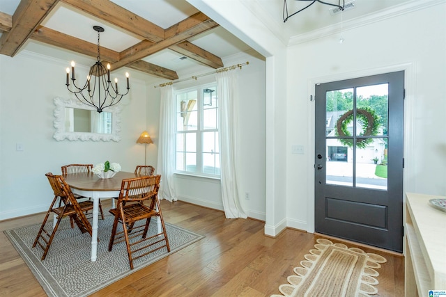 dining room featuring beam ceiling, a notable chandelier, light wood-type flooring, and coffered ceiling