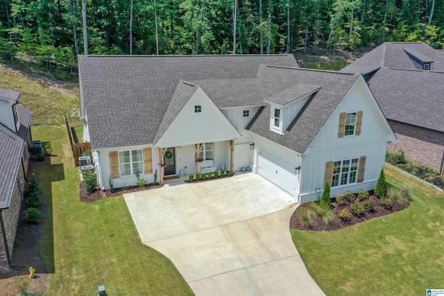 view of front of property featuring a garage and a front lawn