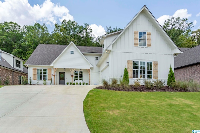 modern farmhouse style home with a front yard