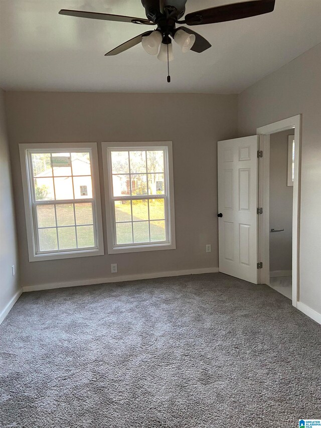 carpeted empty room with ceiling fan