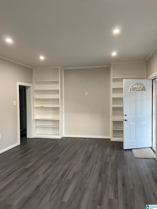 interior space with dark hardwood / wood-style floors and ornamental molding