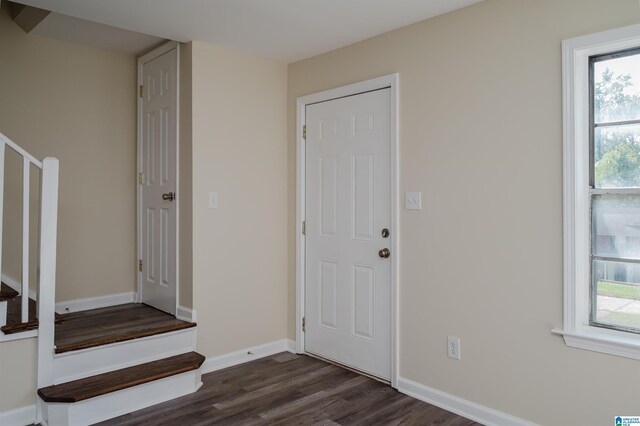 corridor featuring dark wood-type flooring