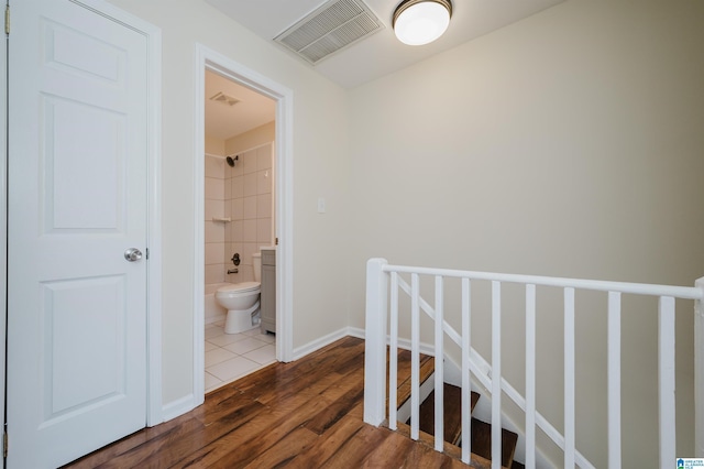 hallway featuring hardwood / wood-style flooring