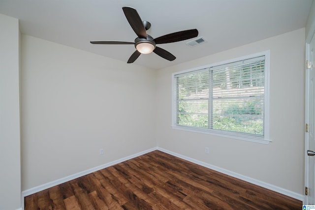 spare room featuring ceiling fan and dark hardwood / wood-style flooring