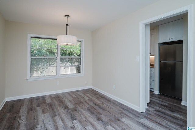 kitchen with dishwasher, black range with gas cooktop, light hardwood / wood-style floors, sink, and white cabinets