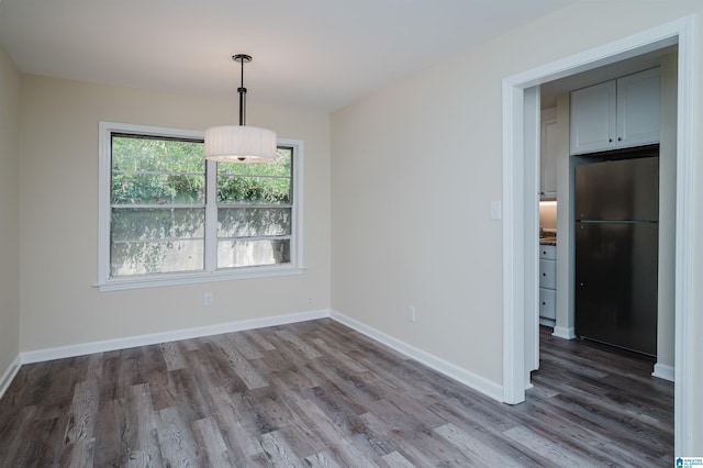 unfurnished dining area with hardwood / wood-style floors