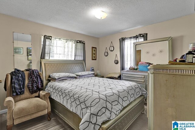 bedroom featuring a textured ceiling