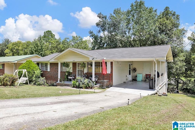 ranch-style house featuring a carport and a front lawn