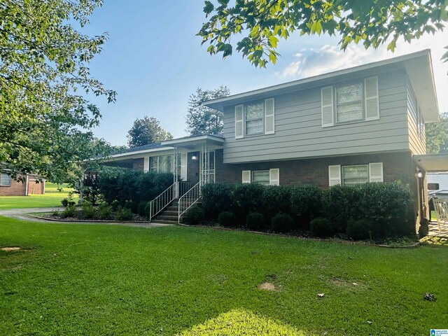 tri-level home featuring a front yard