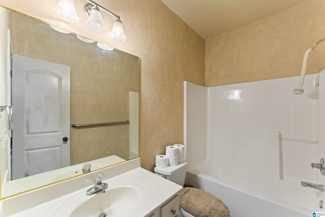 full bathroom featuring toilet, shower / washtub combination, and vanity