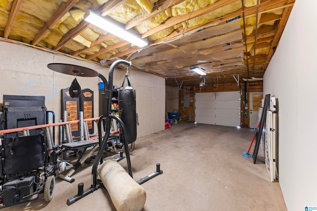 workout room featuring concrete flooring