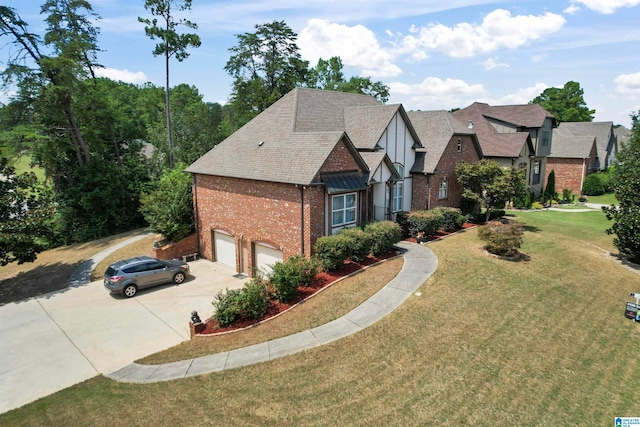 view of front of house with a garage and a front lawn