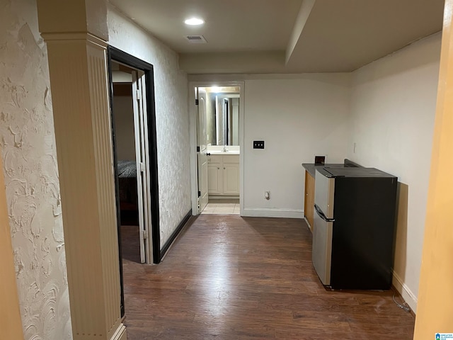 hall with sink and dark hardwood / wood-style flooring