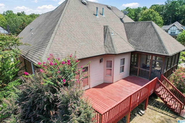 rear view of house with a wooden deck