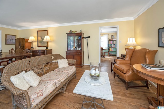 living room featuring ornamental molding and hardwood / wood-style floors