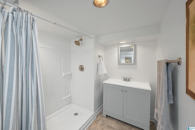 bathroom featuring vanity and a shower with shower curtain