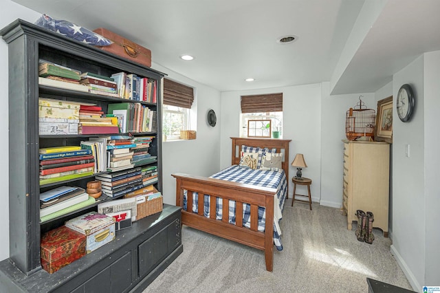 bedroom featuring light carpet