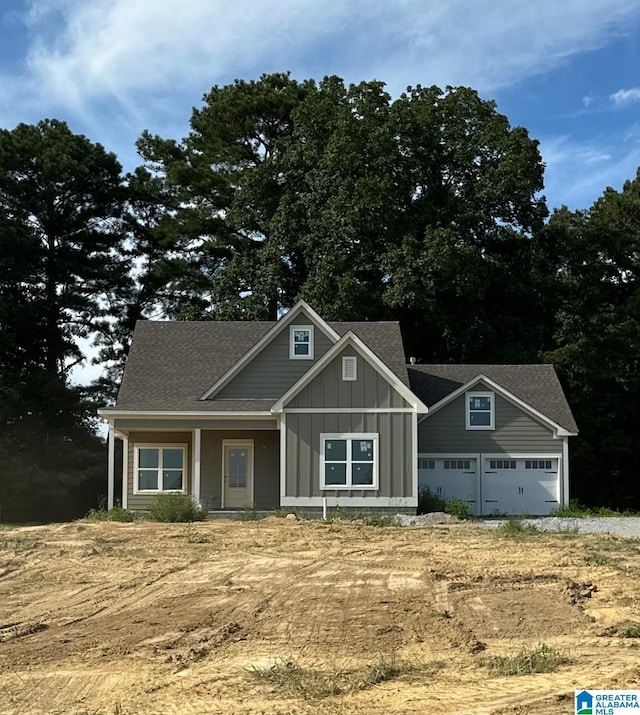 1465 Brooks Dr, Mount Olive, AL 35117 - craftsman inspired home with roof with shingles, board and batten siding, and an attached garage