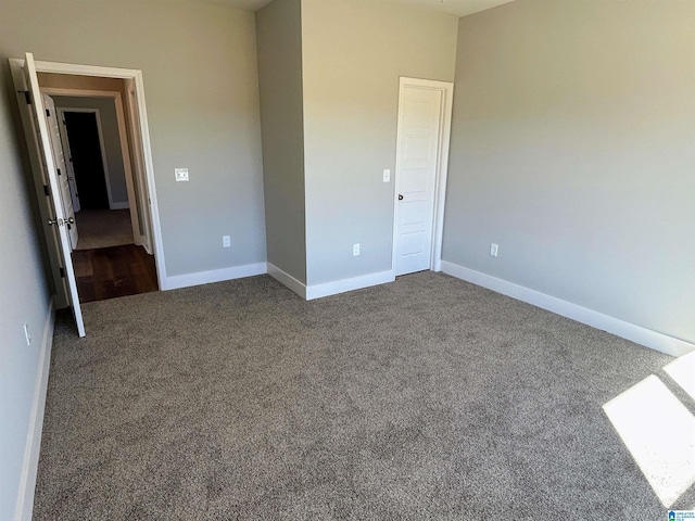 1465 Brooks Dr, Mount Olive, AL 35117 - unfurnished bedroom with baseboards and dark colored carpet