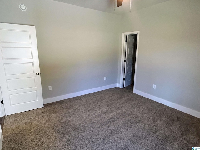 1465 Brooks Dr, Mount Olive, AL 35117 - unfurnished room with dark carpet, baseboards, and ceiling fan
