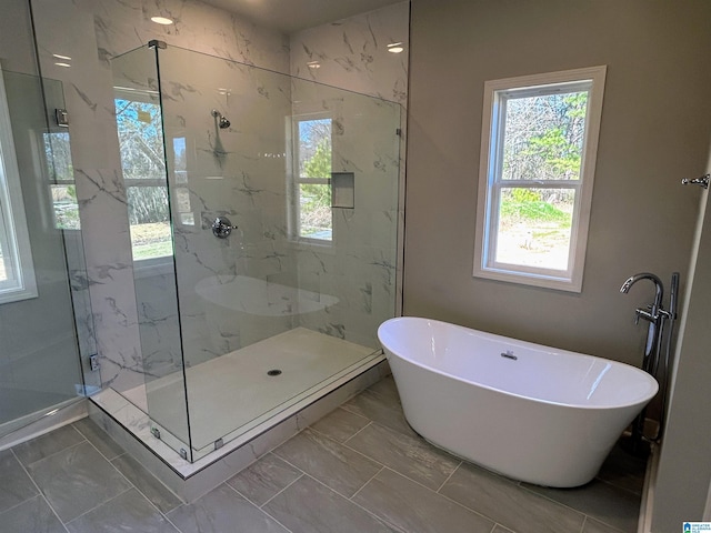 1465 Brooks Dr, Mount Olive, AL 35117 - full bath featuring a freestanding tub, marble finish floor, and a marble finish shower